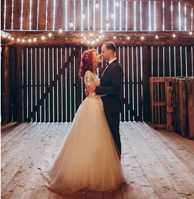 Bride and groom in a barn